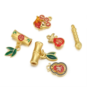 Detail of six traditional Chinese gold pendants with colorful enamel lucky symbols