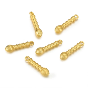 Detailed view of matte gold brush charms with Jin Bang Ti Ming engraving for DIY jewelry