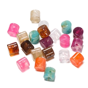 Detail of colorful acrylic cylindrical beads with marble texture for DIY jewelry making