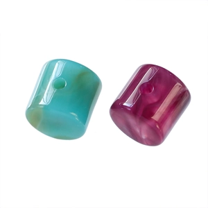 Macro view of blue and pink marble acrylic cylindrical beads with high polished finish