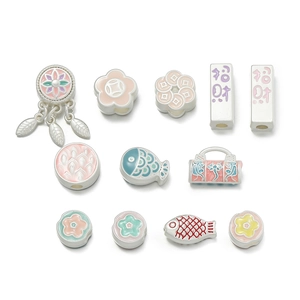 Detail of colorful enamel charms with traditional patterns and Chinese auspicious symbols