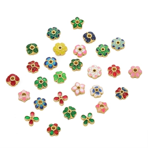 Detailed macro shot of 10mm colorful enamel flower spacers for DIY jewelry making