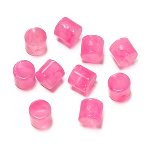 Macro detail of cylindrical magenta acrylic stone beads with white marble texture
