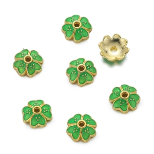 Detailed view of 10mm green enamel gold flower spacers for DIY jewelry bracelets