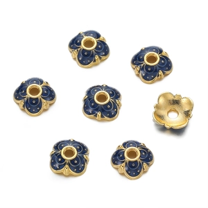 Detail of 10mm flower-shaped blue enamel bead caps with 18K gold-plated metal edges for DIY