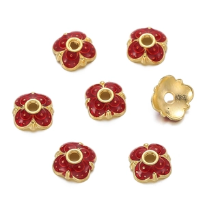 Detailed view of 10mm gold-plated flower bead caps with red enamel for DIY jewelry making