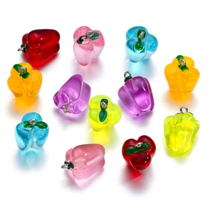 Macro shot of colorful transparent resin bell pepper charms for DIY jewelry making