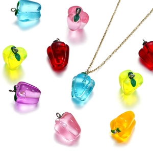 Colorful resin bell pepper charms with silver loops on a delicate gold chain necklace