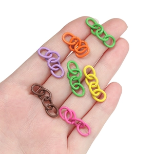 Handheld view of colorful matte paint metal link chains for DIY keychain accessories