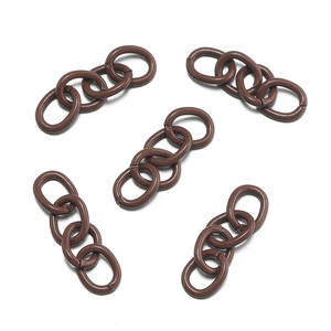 Detailed view of five brown four-link acrylic chain extenders for DIY accessory making