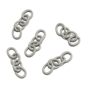 Macro detail of matte grey four-link chain connectors for DIY jewelry and keychain crafts