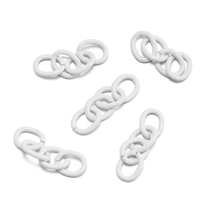 Close-up of four-link white painted metal oval rings for DIY jewelry and keychain making