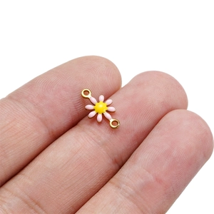 Detailed view of pink daisy enamel pendant link for DIY jewelry bracelets and necklaces