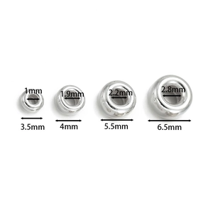 Macro view of 925 silver spacer beads showing precise inner and outer diameter measurements