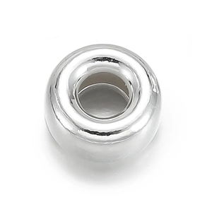 Macro view of a polished 925 sterling silver donut bead for DIY jewelry making