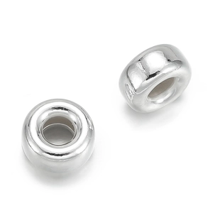 Macro detail of polished 925 sterling silver flat bubble beads for DIY jewelry making