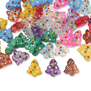 Macro detail of assorted colorful Christmas tree beads with hand-painted polka dots for DIY