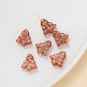 Macro shot of brown Christmas tree beads with colorful polka dots for DIY jewelry