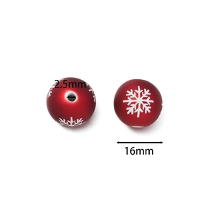 Dettaglio di perle in acrilico rosso 16mm con fiocchi di neve e foro da 2,5mm