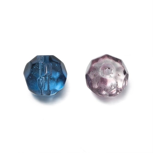 Detailed macro view of 10mm faceted glass beads in gradient blue and purple for DIY jewelry