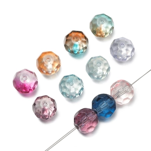 Macro detail of 10mm faceted mermaid gradient crystal beads with central perforation