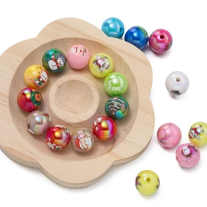 Macro shot of colorful acrylic Christmas beads with pearlescent finish for DIY jewelry