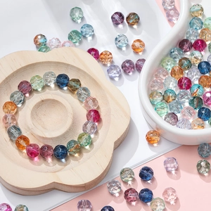 Detailed view of 10mm faceted gradient crystal glass beads in pastel colors for DIY jewelry