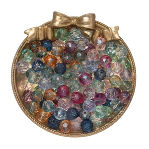 Macro view of 10mm faceted glass crystal beads in colorful tray for DIY jewelry