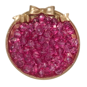 Macro view of 10mm rose red faceted crystal beads on a gold tray for DIY jewelry