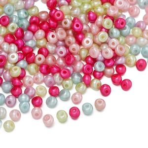 Dettaglio di perle acriliche colorate irregolari a forma di goccia per gioielli fai-da-te