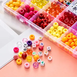 Detail of 24-grid organizer box filled with colorful large-hole and letter beads for DIY jewelry