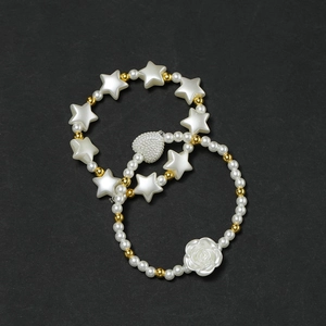 Star-shaped beads and white faux pearls DIY bracelet set with gold heart pendant