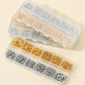 DIY jewelry making kit with gold and silver lobster clasps and jump rings in a clear box