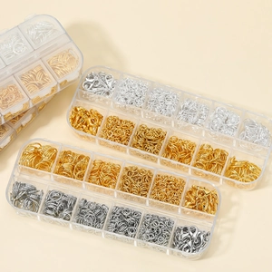 DIY jewelry making kit with gold and silver jump rings and lobster clasps in storage boxes