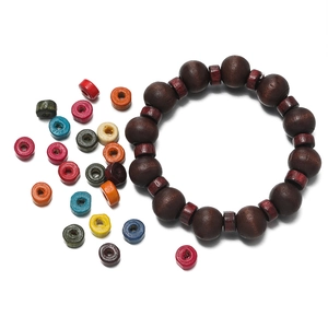 Detailed macro view of mixed macaron color wooden spacer beads for DIY jewelry making
