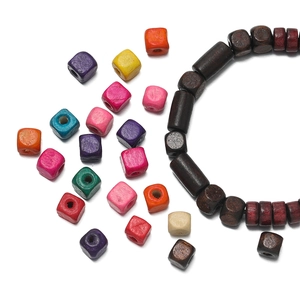 Macro shot of colorful cube wooden beads with pre-drilled holes for DIY jewelry making