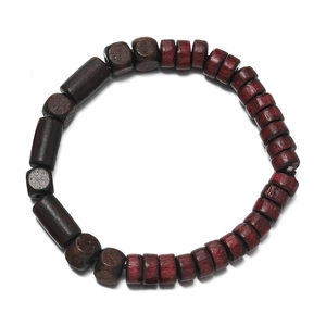 Close-up of square and cylindrical wooden beads for DIY ethnic jewelry making