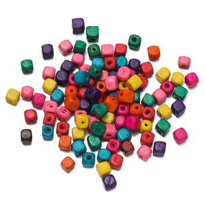 Detailed macro view of colorful square wooden beads with pre-drilled holes for DIY jewelry