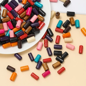 Macro shot of colorful cylindrical wooden spacer beads for DIY jewelry making and crafts