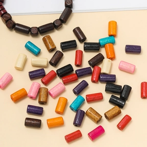Detailed view of colorful tubular wooden beads for DIY jewelry and bracelet making