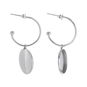 Detail of silver stainless steel C-shaped ear hooks with round blank tray pendants for DIY