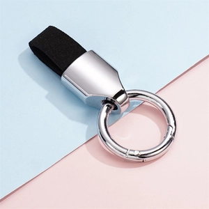 Detail of premium black suede leather strap and silver spring ring for car keychain