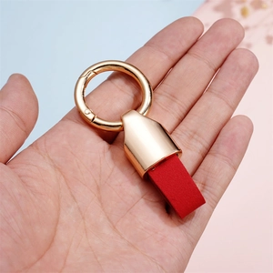 Short luxury alloy leather keychain with red microfiber strap and golden spring ring hook