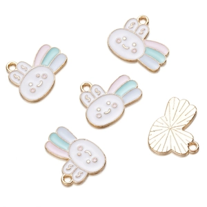 Detail view of five cute bunny alloy pendants with colorful enamel stripes for DIY jewelry
