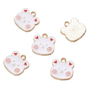 Macro shot of 5 alloy enamel bear pendants showing front details and gold textured back