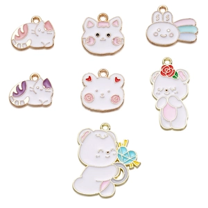 Detail of assorted pastel enamel animal pendants for DIY keychains and jewelry