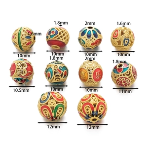 Detail showing 10-12mm hollow enamel beads with gold plating and lucky Chinese characters