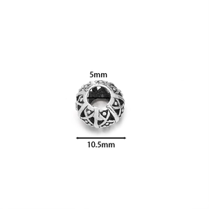 Detailed view of silver hollow spacer bead showing 5mm hole and 10.5mm outer diameter