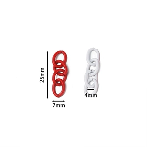 Macro detail of red and white lacquered 4-link metal chains for DIY jewelry making
