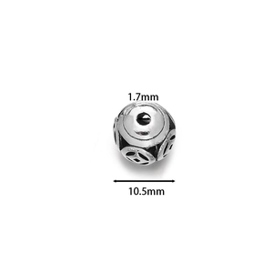 Macro detail of hollow cloisonne bead showing 10.5mm diameter and 1.7mm hole size